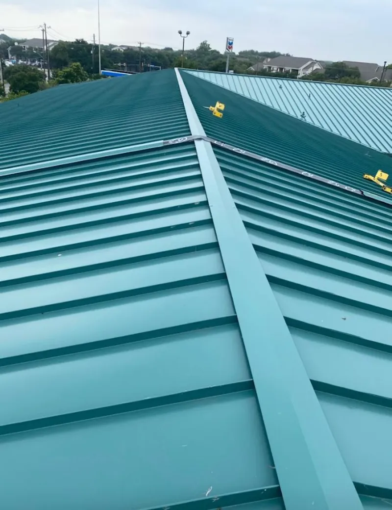 Green commercial metal roof ridge and valley for Metal Roof Repair in Whitfield